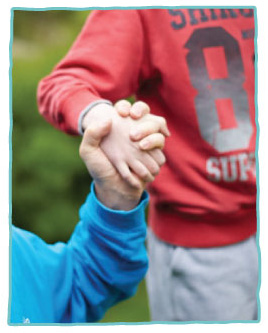 Close-up of two people holding hands