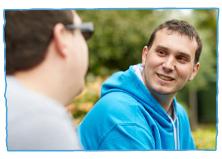 Care worker smiling with client